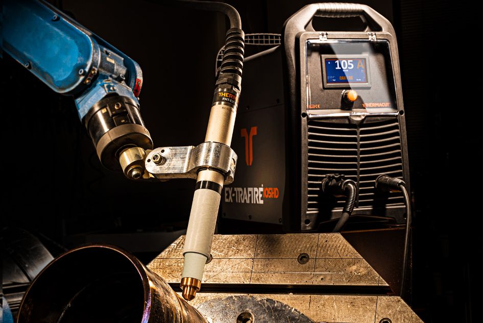 a robotic arm with a cnc plasma torch on the end connected to a 105HD plasma cutter