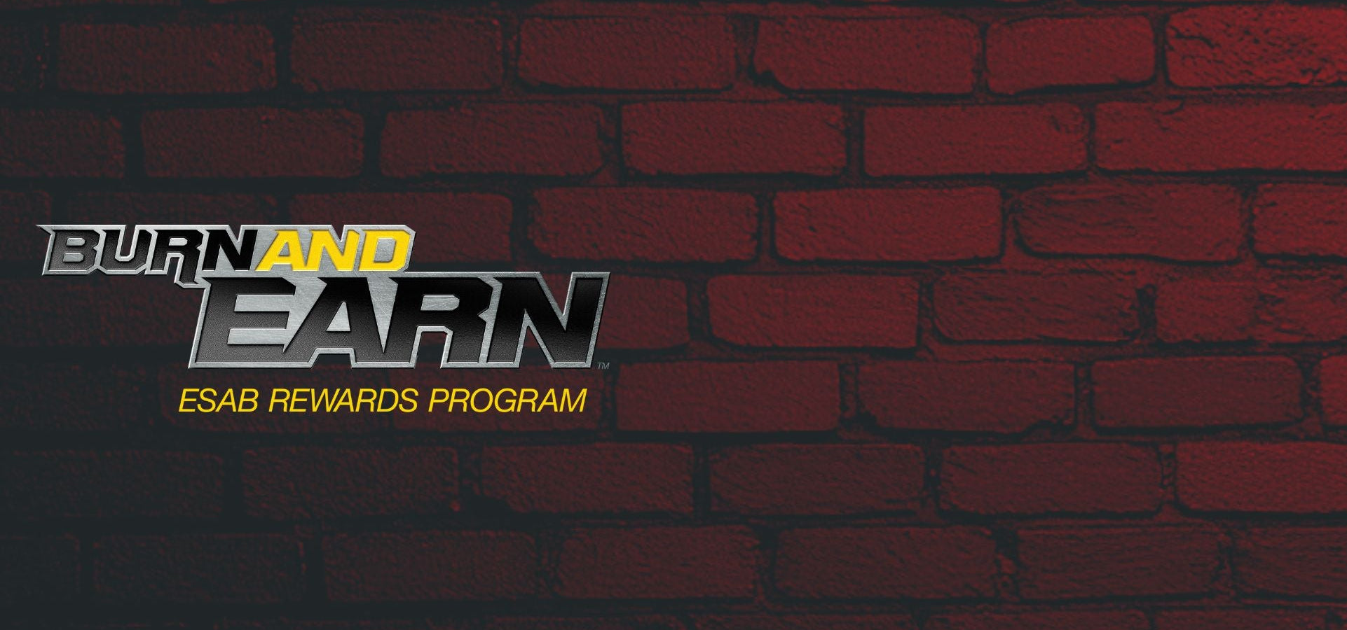 Brick wall with 'Burn and Earn' Esab Rewards Program logo
