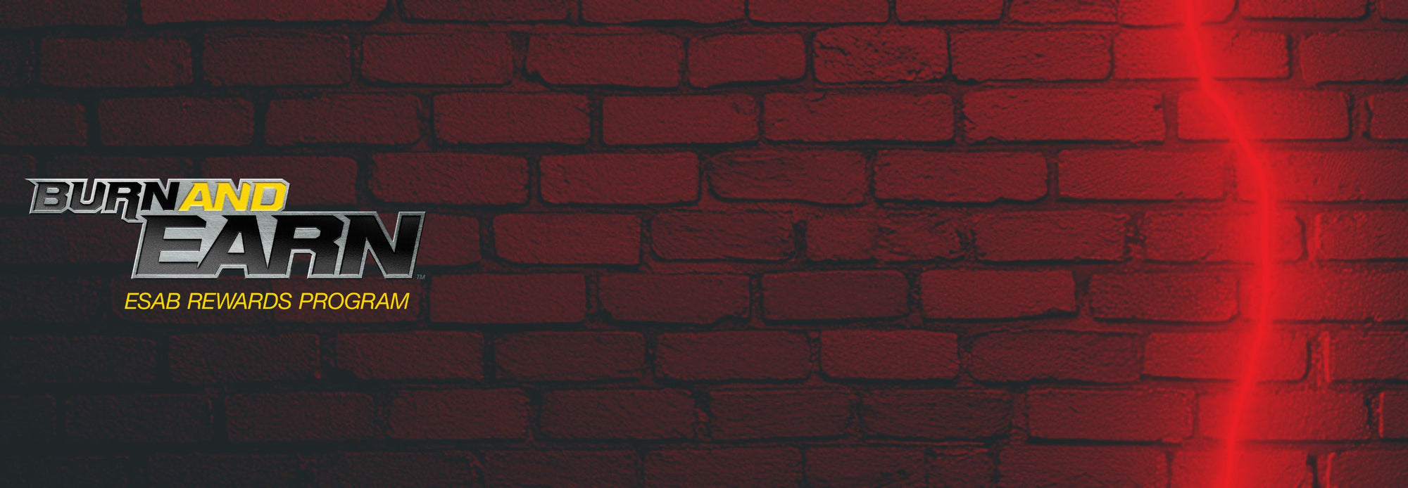 Brick wall with 'Burn and Earn' Esab Rewards Program logo