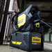 Renegade Volt by ESAB out in the field of construction with shoulder strap attached. 