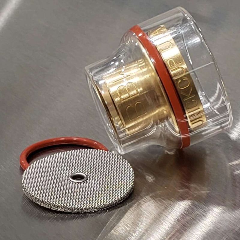 large diameter furick glass cup with brass gas lens installed and spare diffuser and o ring to the side