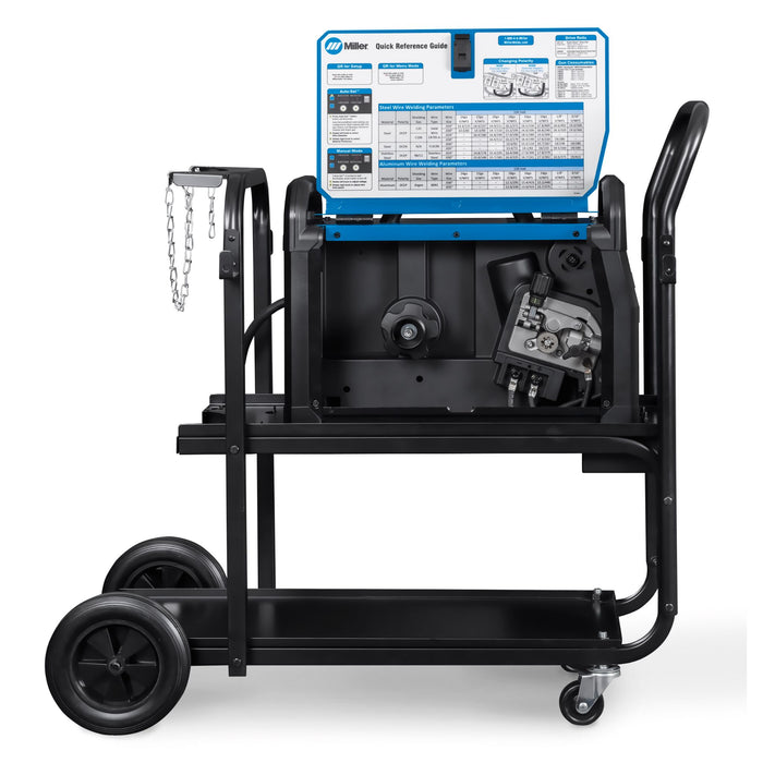 miller millermatic 142 on cart with flap up showing drive roll and place for roll of mig wire to go