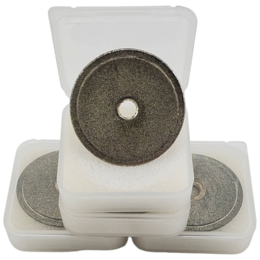A stack of three diamond wheels for powerweld tungsten grinder. The top case is open to show the wheel itself