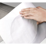 sizing up a sheet of aquasol purge welding paper to be cut