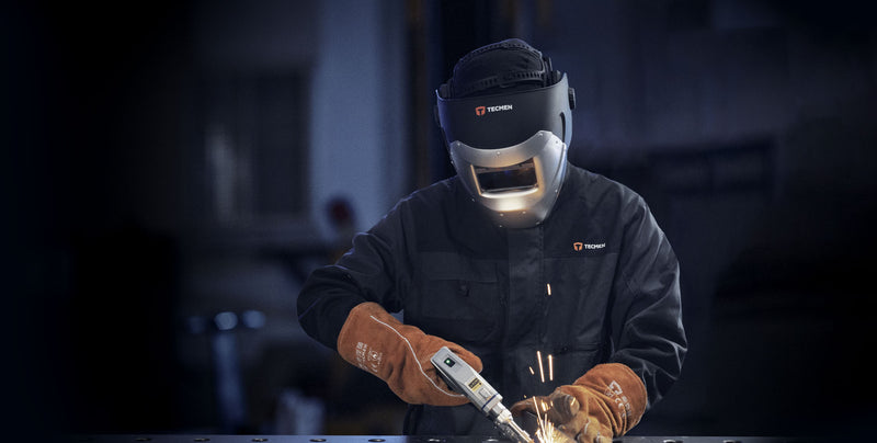 man laser welding while wearing tecmen 100lw laser welding helmet