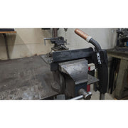 kent welding gun in shop hooked onto piece of steel