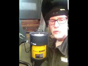 man showing plymovent portable fume extractor in use