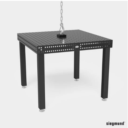 Siegmund welding table being moved with overhead crane using shipping bracket