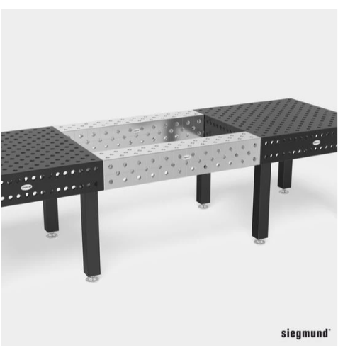 two siegmund system 28 welding tables joined by two riser blocks using short connecting bolts
