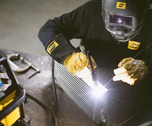 action shot of tig welding using esab rebel emp 205ic multiprocess welder