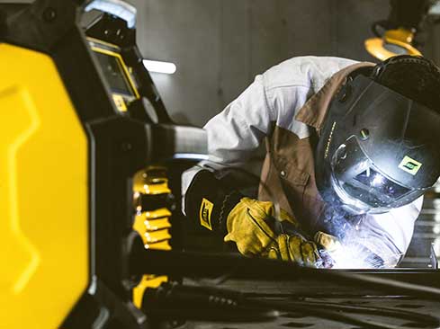 action shot of MIG welding using esab rebel emp 205ic multiprocess welder