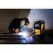 action shot of a welder performing a mig weld on esab rebel emp 215ic
