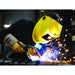 man mig welding while wearing yellow esab savage welding helmet