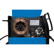 interior of miller millermatic 252 mig welder showing drive roll and a spool of steel mig wire