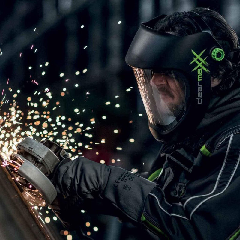 man grinding steel while wearing optrel clearmaxx grinding shield