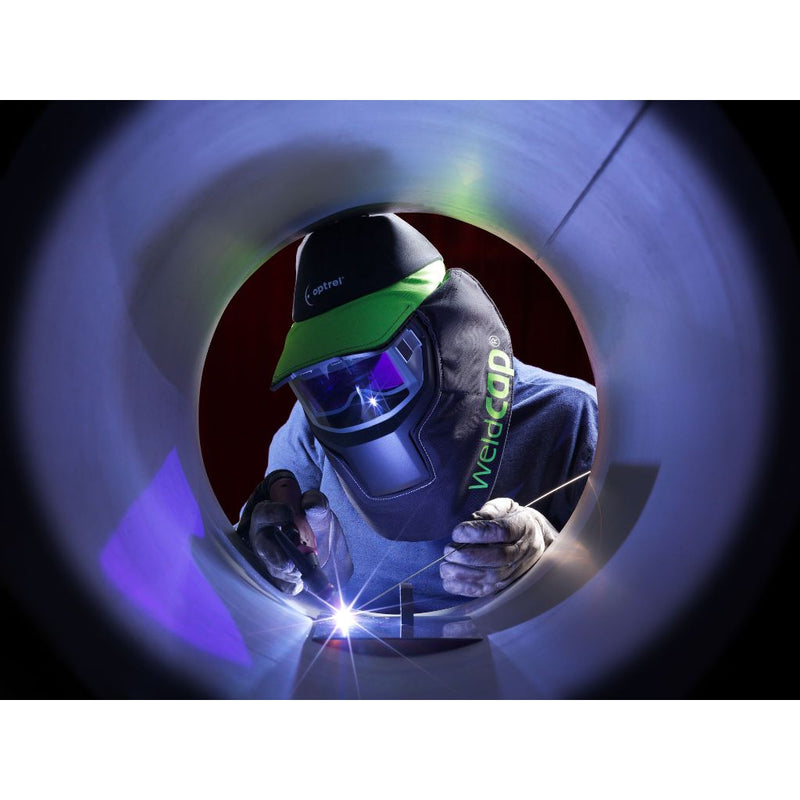 man tig welding inside of a pipe wearing optrel weldcap RC3/9-12 welding helmet
