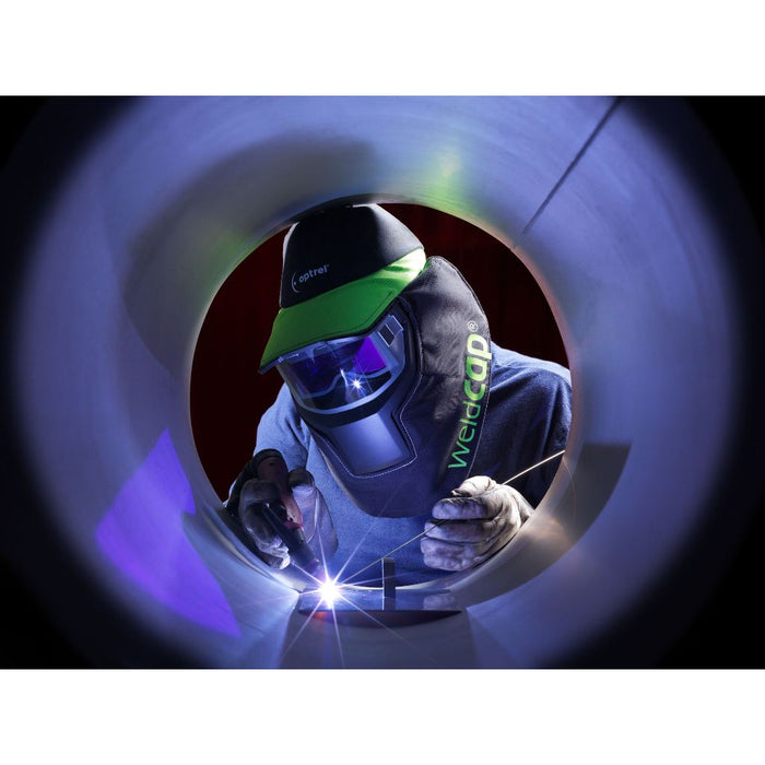man tig welding inside of a pipe wearing optrel weldcap RC3/9-12 welding helmet