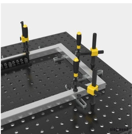 siegmund flex stops being used to hold rectangular frame in place on welding table